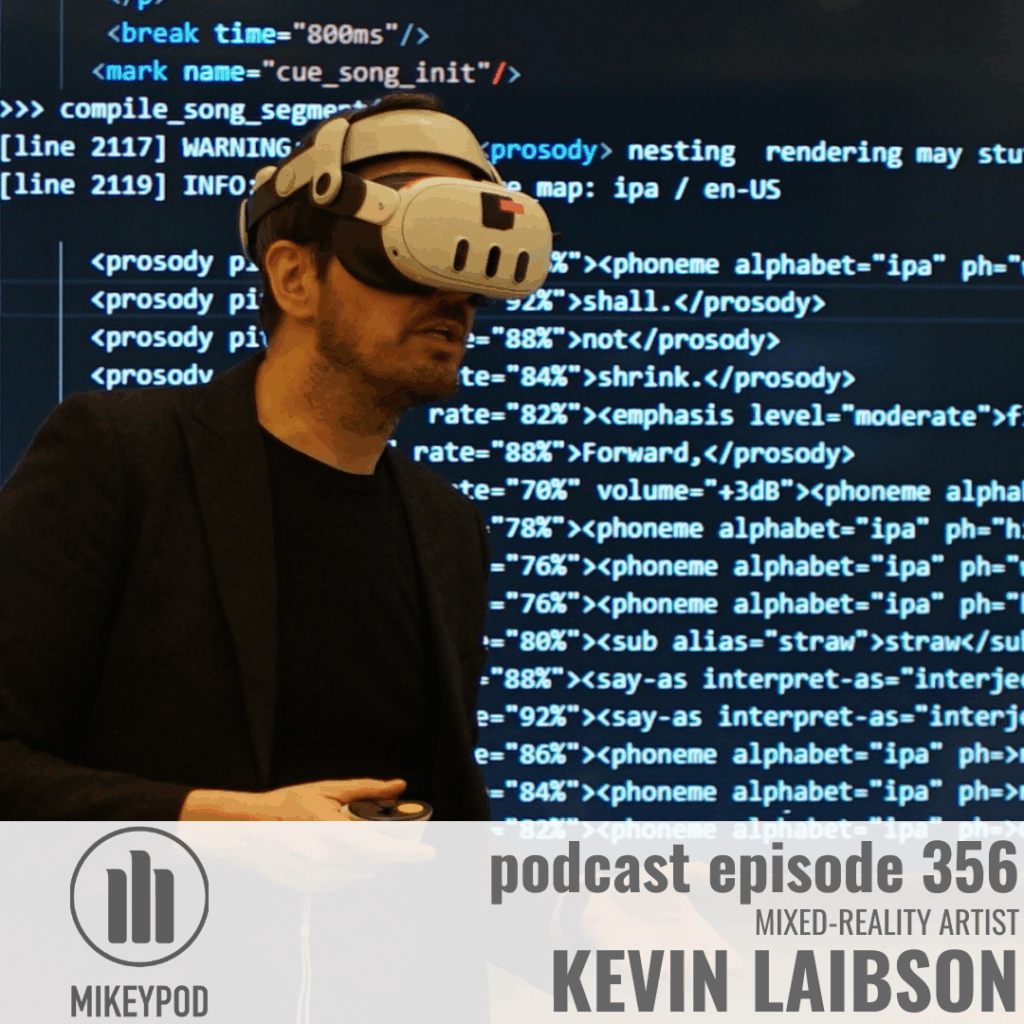 A man wearing a cream-colored VR headset stands in front of a computer monitor displaying blue code. MikeyPod logo and text overlay for podcast episode 356.